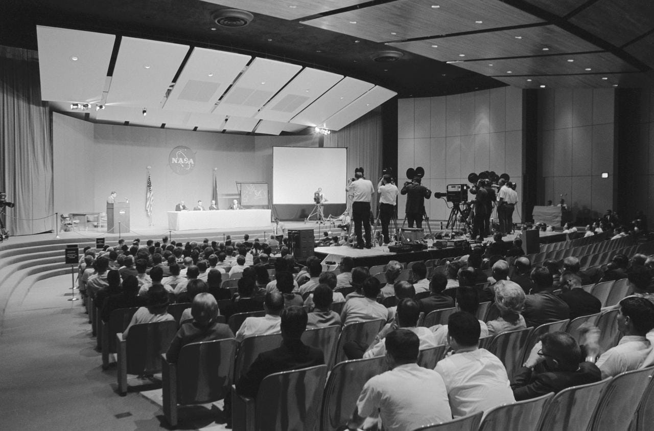 NASA press conference in auditorium in the 1960s